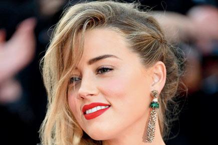 Amber Heard donates USD 7 million divorce settlement to charity