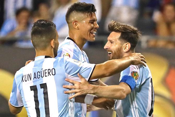 CHICAGO, IL - JUNE 10: Lionel Messi #10 of Argentina (R) celebrates his third goal against Panama with teammates Sergio Aguero #11 and Marcos Rojo during a match in the 2016 Copa America Centenario at Soldier Field on June 10, 2016 in Chicago, Illinois. Argentina defeated Panama 5-0. Jonathan Daniel/Getty Images/AFP