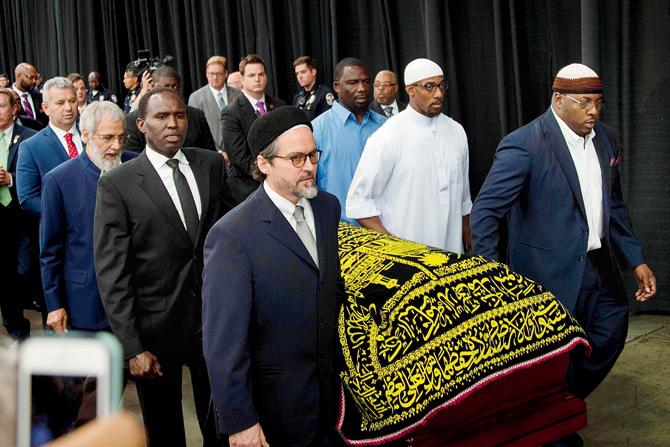 Pallbearers escort the casket of Ali during the Jenazah prayer service at Freedom Hall in Louisville, Kentucky on Thursday