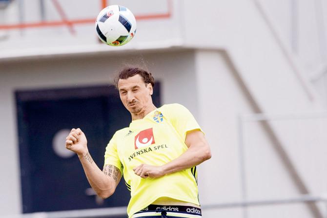 Sweden’s captain Zlatan Ibrahimovic attempts a header during a training session yesterday. Pic/AFP