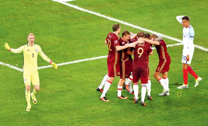Russian players celebrate their equaliser while England
