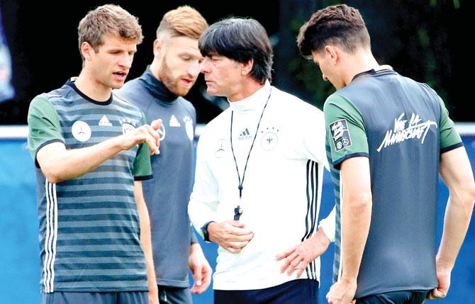 Germany coach Joachim Loew talks to his players Thomas Mueller (left), Shkodran Mustafi and Mario Gomez (right) during a training session at Ermitage Evian in France on Thursday. Pic/Getty Images