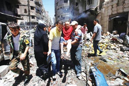 Suicide bombers kill 20 in Syria