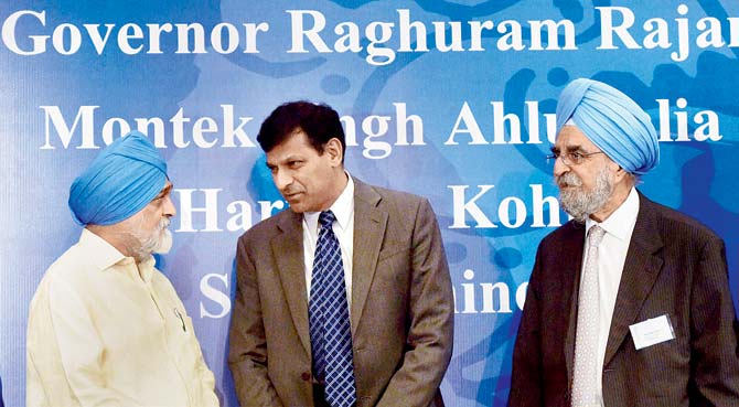 RBI Governor Raghuram Rajan (c) with economist Montek Singh Ahluwalia (l) and Harinder Kohli, chief executive of Emerging Markets Forum, during the launch of a book titled The World in 2050 in Mumbai. Pic/PTI