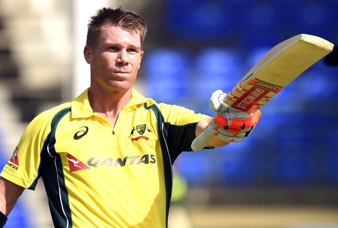 Australian cricketer David Warner celebrates after scoring his century against South Africa during their Tri-nation series One Day International match at the Warner Park stadium in Basseterre, Saint Kitts. Pic/AFP