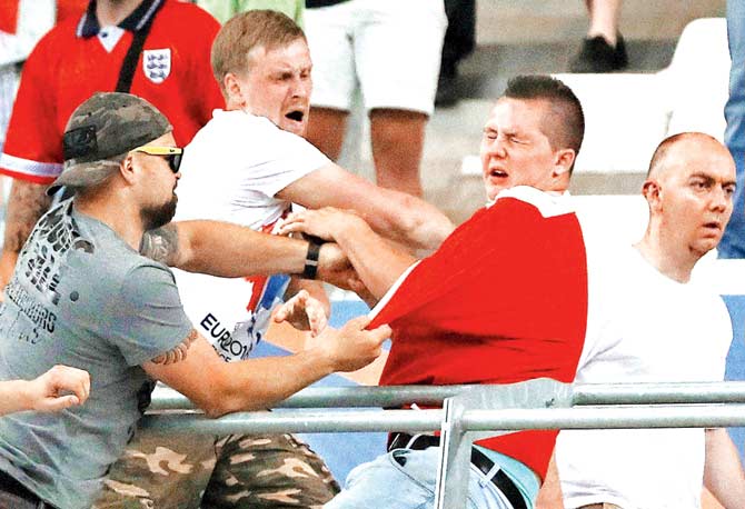 Russian supporters attack an England fan. Pics/AP, PTI