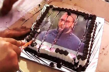 MNS chief Raj Thackeray cuts cake with Owaisi picture on birthday