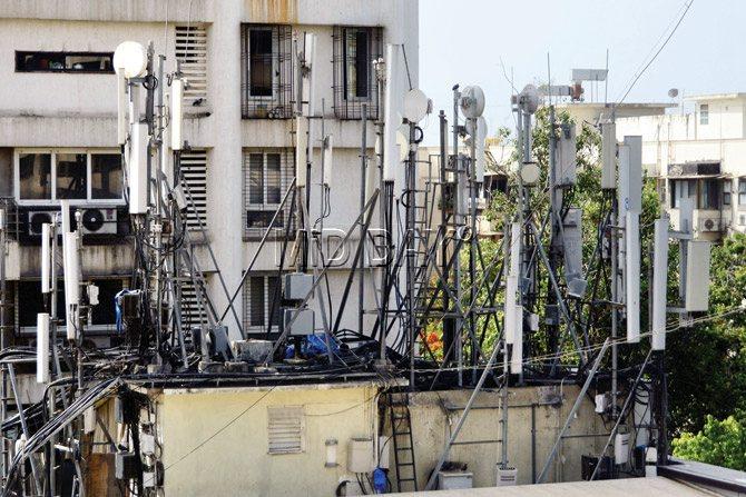 Fear reigns supreme: The mobile phone towers atop Hotel Supreme in Cuffe Parade are packed close to each other, their wires and chords dangerously close to the power cabins. PICs/BIPIN KOKATE 