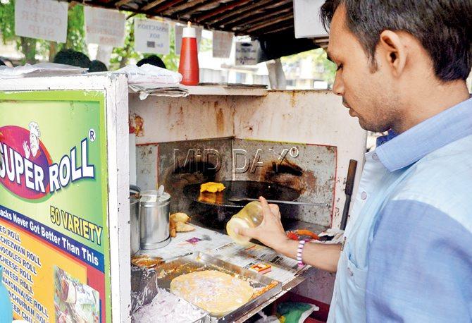 Pintu, who runs a frankie stall attached to Jalaram Store, makes mayo frankie