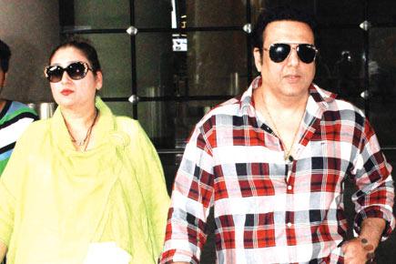Spotted: Govinda with his wife Sunita at Mumbai airport
