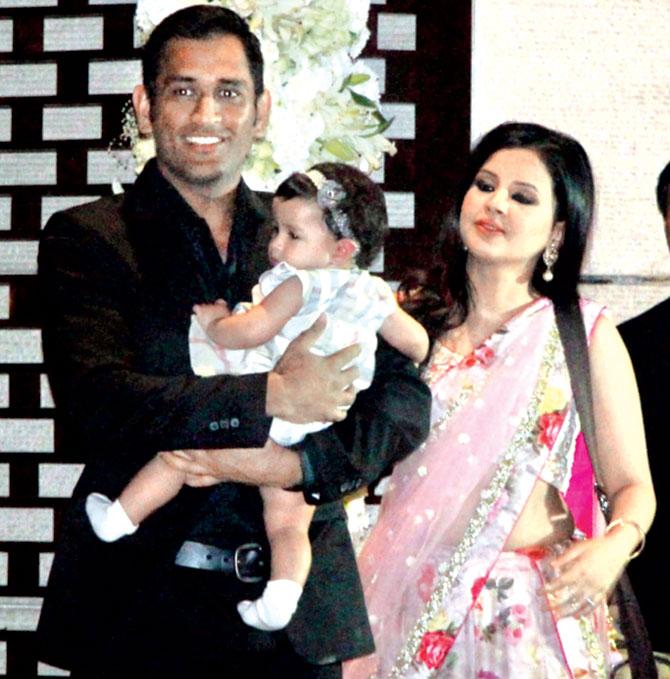 MS Dhoni with wife Sakshi and daughter Ziva at a party in Mumbai last December