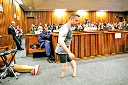 Sobbing Oscar Pistorius walks on stumps in court