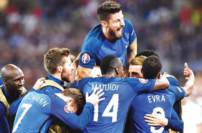 France forward Olivier Giroud (top) celebrates with teammates after a goal during the Group A match against Albania at Velodrome Stadium in Marseille on Wednesday. France won 2-0 to lead the points table. Pic/AFP