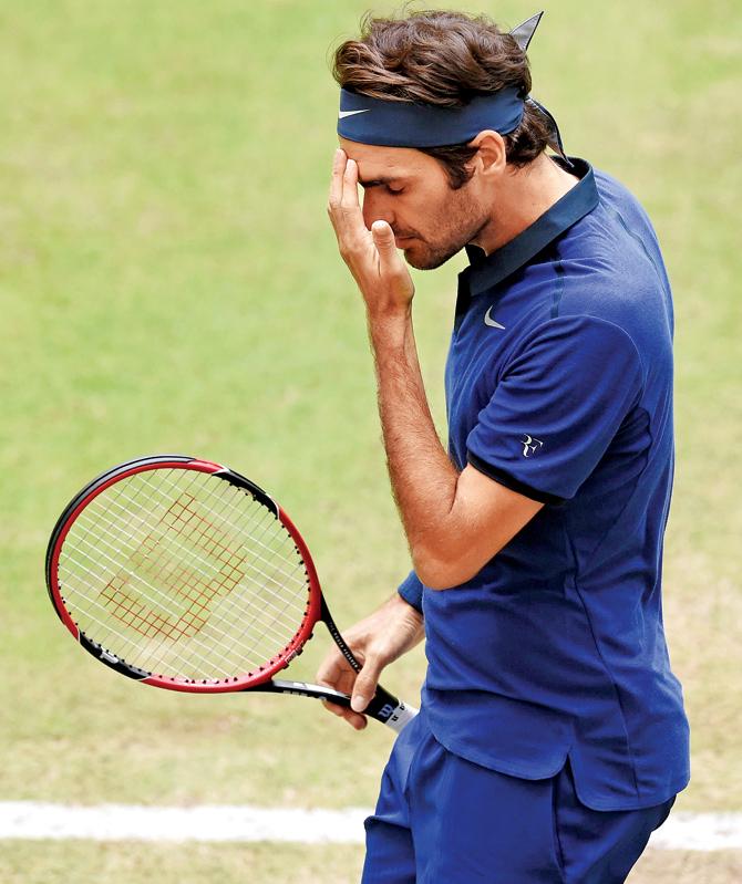 Roger Federer reacts after losing a point to Alexander Zverev in Halle on Saturday. 