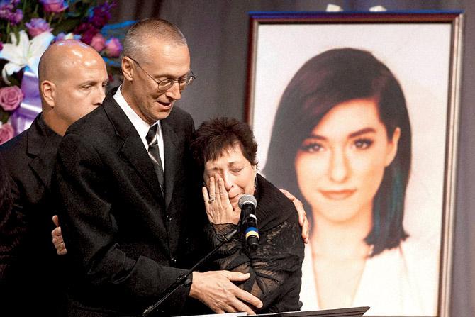 Christina Grimmie’s mother, Tina is comforted by husband Bud during the singer’s memorial service. pic/pti 