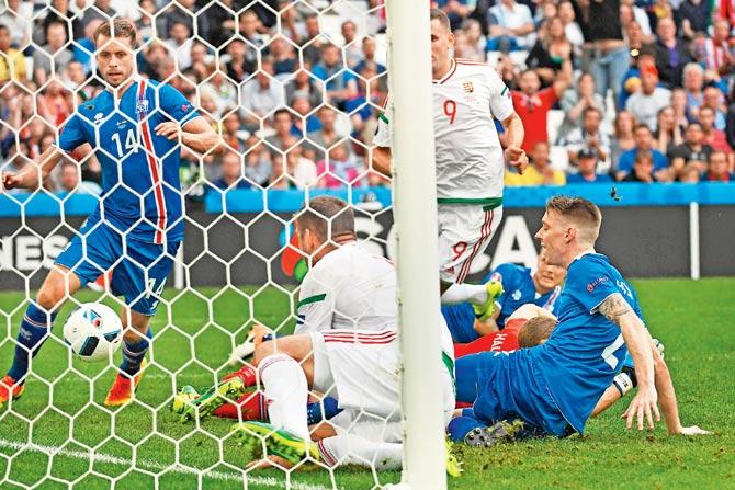 Iceland defender Birkir Saevarsson (right) scores an own goal during the Euro 2016 Group F match against Hungary at Stade Velodrome  in Marseille, France on Saturday. pic/AFP