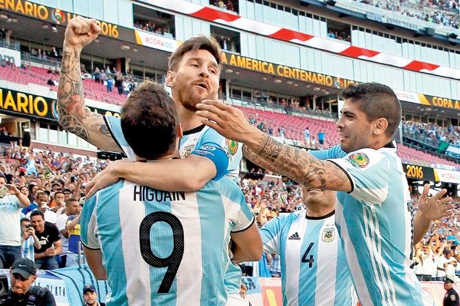 A jubilant Lionel Messi (centre) celebrates his goal with teammates during the Copa America quarter-final against Venezuela at Gillette Stadium in Massachusetts, United States on Saturday. Argentina won 4-1. pic/Getty Images