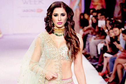 Is Nargis Fakhri's contract with her management agency in jeopardy?