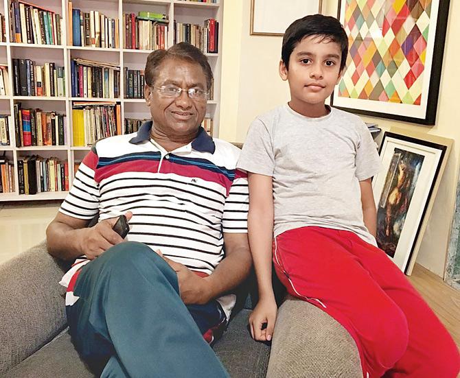 all in the family: Hockey wizard Dhyan Chand’s son Ashok Kumar with his grandson Ambar (right) at their home in Colaba yesterday