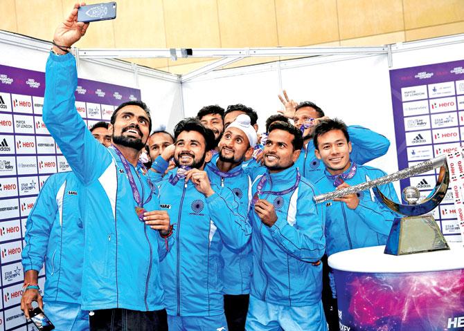 Members of the Indian hockey team take a selfie with their Champions Trophy runners-up medals at the Queen Elizabeth Olympic Park in London recently. Pic/Getty Images