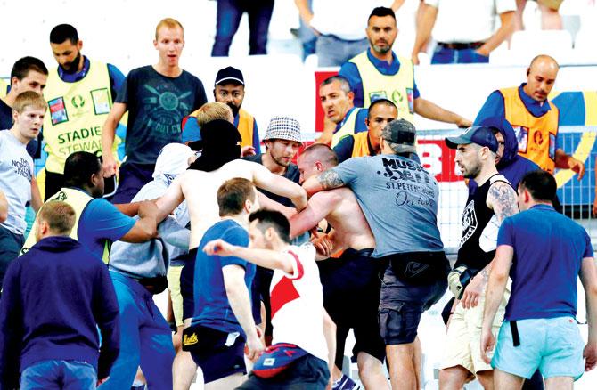 Russian and English supporters clash at the end of their teams