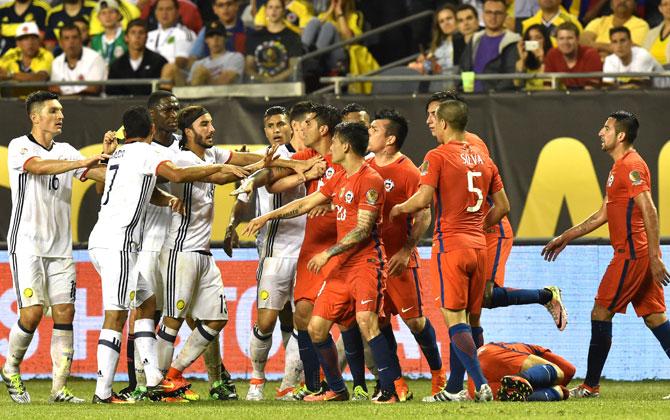 Chilena players (R) argue with Chile