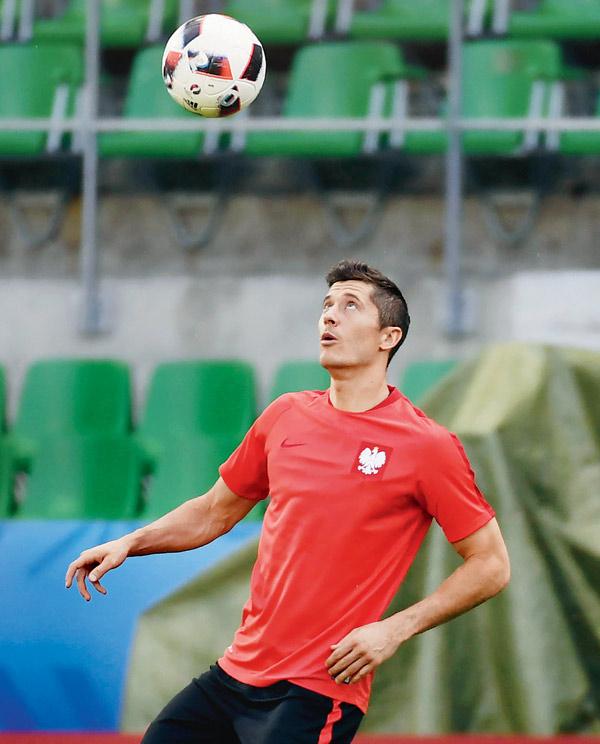 Poland’s Robert Lewandowski takes part in a training session at the Geoffroy Guichard stadium in Saint-Etienne on the eve of their Euro clash against Switzerland yesterday. Pic/AFP