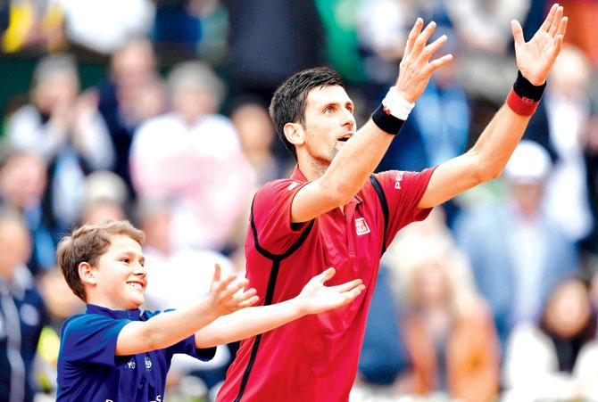 Novak Djokovic celebrates his fourth round win against Spain