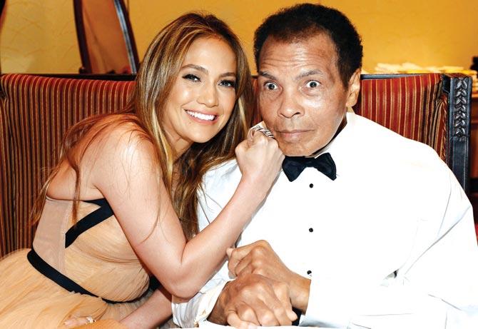The greatest and me: Singer Jennifer Lopez and Ali share a light moment during the Muhammad Ali Celebrity Fight Night XIX in Arizona on March 22, 2013. Pic/AFP