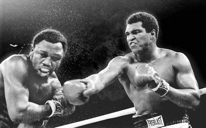 Muhammad Ali lands a punch on Joe Frazier during their title fight in Manila, Philippines in 1975. Pic/AP