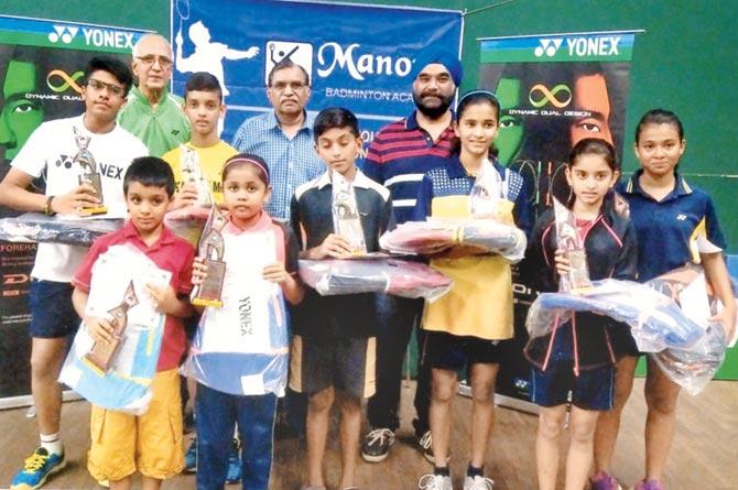 Khar Gym badminton tournament winners with their trophies