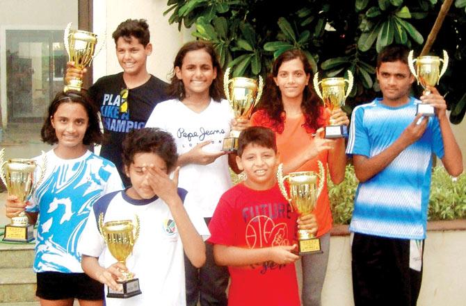 Maharashtra State aquatic meet winners pose with their trophies