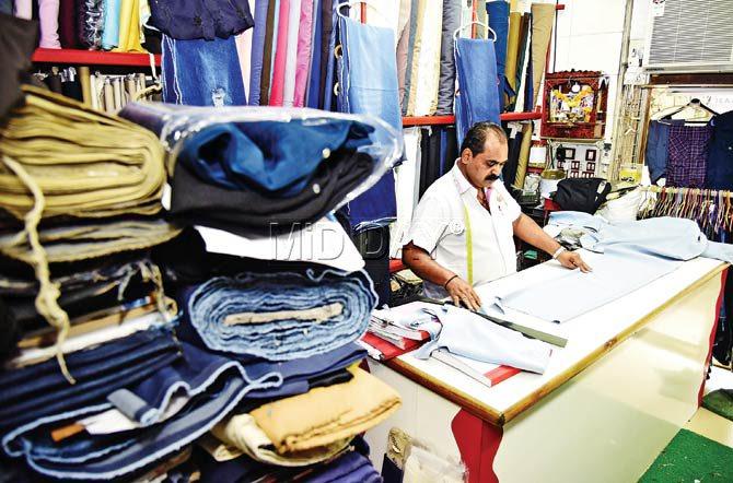 Atul Babubhai Parmar, owner of J5 Jeans Master at his shop in Tardeo. Pic/Shadab Khan