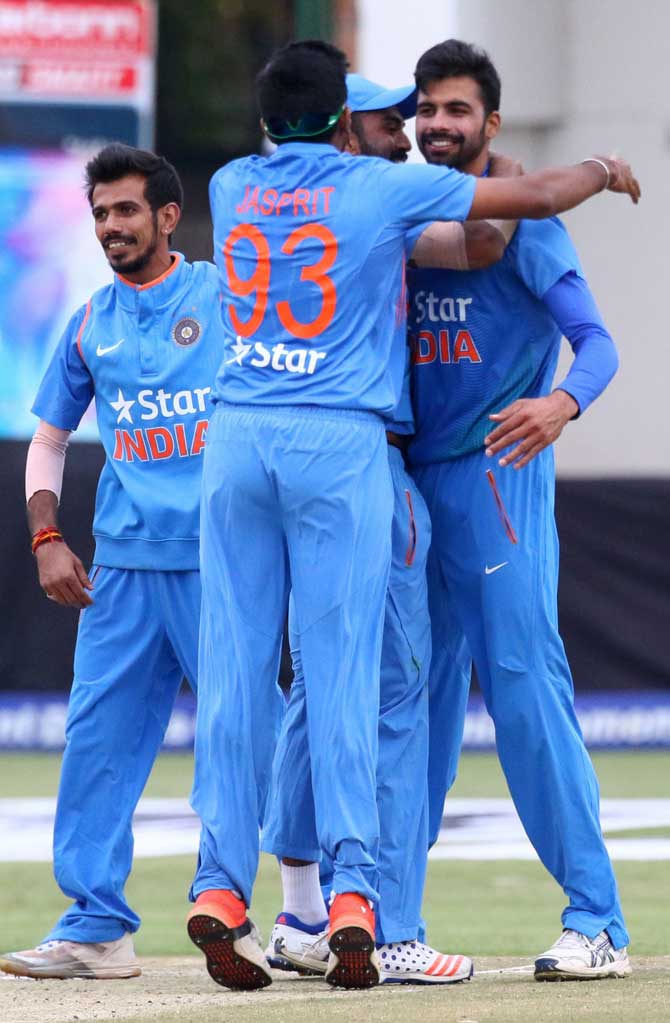 India players celebrate with bowler Barinder Sran after victory during the third and final T20 cricket match.