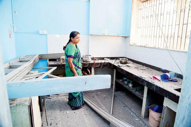 V Sundar looks at the wreck at her sister’s home in a building. Pics/Sameer Markande