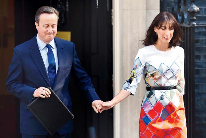 British Prime Minister David Cameron and wife Samantha step out of 10 Downing Street in London yesterday to announce his resignation. Pic/AFP