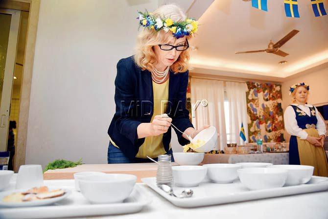 Wearing a midsommarkrans, Fredrika Ornbrant, Consul General of Sweden prepares Swedish fare to celebrate Swedish National Day and the Midnight Sun. Pic/Sameer Markande