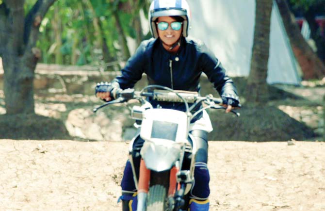 Geeta Tandon on a stunt bike