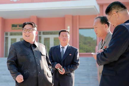 Kim Jong-un defies North Korea's no-smoking rule