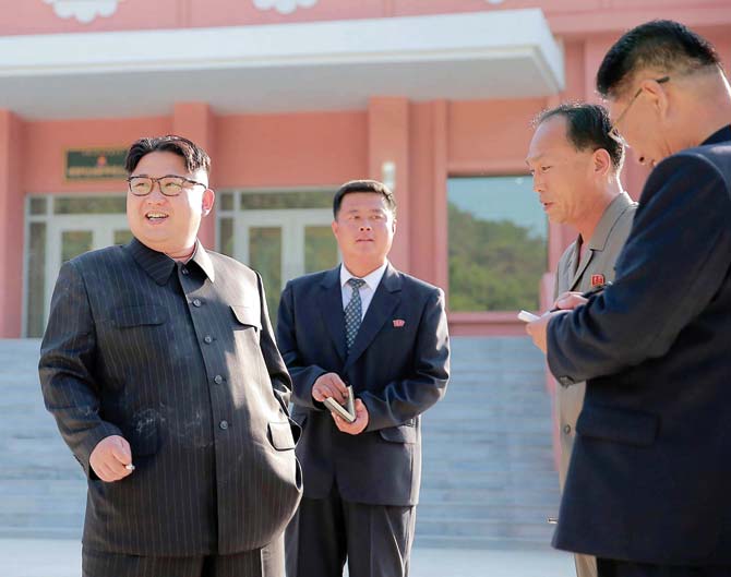 This undated picture released from North Korea’s official Korean Central News Agency (KCNA) on June 4 shows Kim Jong-un with a cigarette in his hand. Pic/KCNA