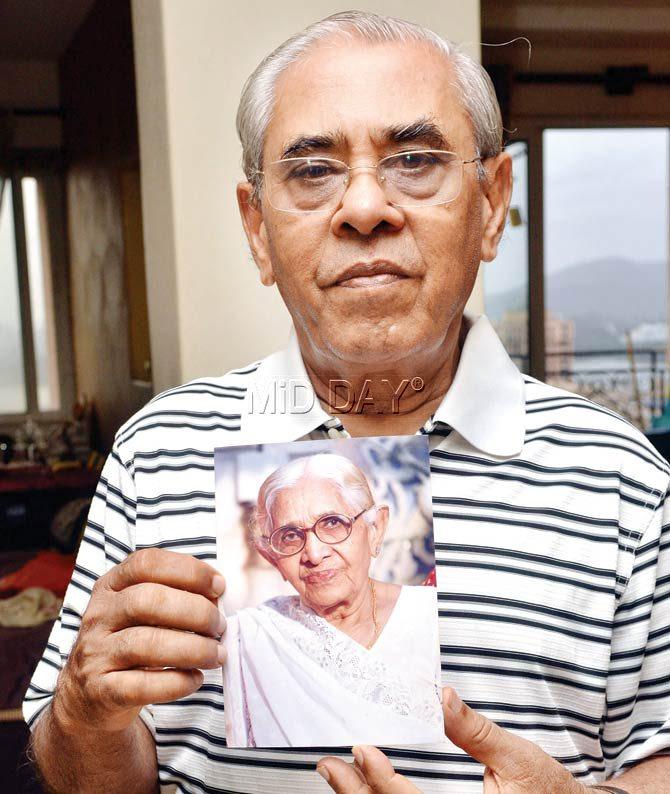 Mahesh Shah holds up a picture of his mother. Pic/Datta Kumbhar