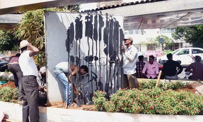 The artwork was uprooted from Marine Drive on Tuesday. Pics/Suresh Karkera