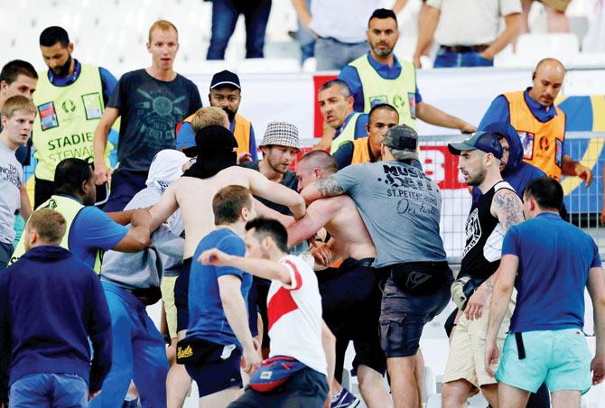 Supporters clash at the end of the Euro 2016 match between England and Russia at Stade Velodrome in Marseille on Saturday. pic/afp