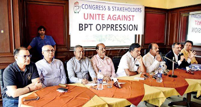 Viren Assar (second from right) and Vinod Shekhar (third from right) speak about the need for MbPT tenants to agitate at a meeting held at the Radio Club. Pics/Shadab Khan