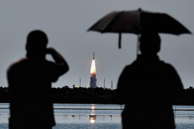 Onlookers watch the PSLV C-34 rocket take off from the second pad of the Satish Dhawan Space Centre at Sriharikota yesterday.