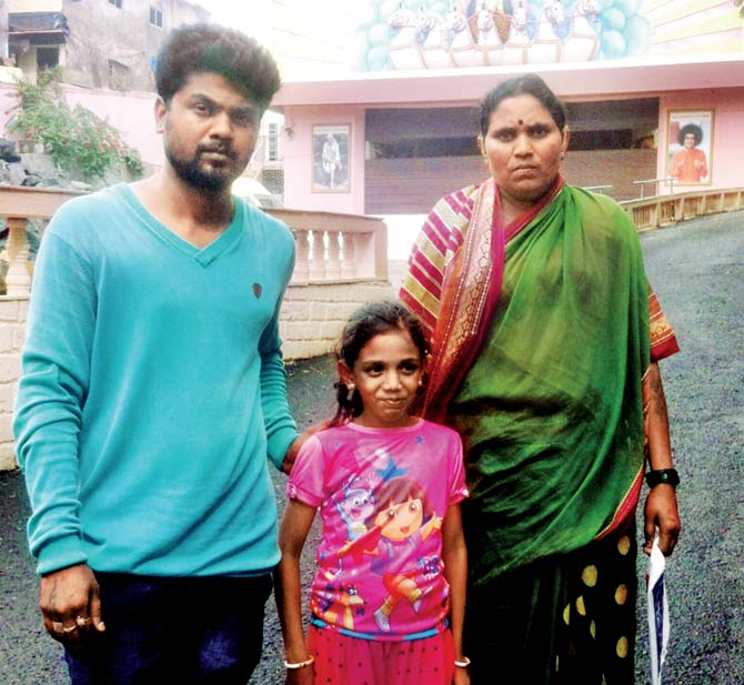 Swati with her mother and elder brother in front of Sri Satya Sai Vidya Mandir in Andheri