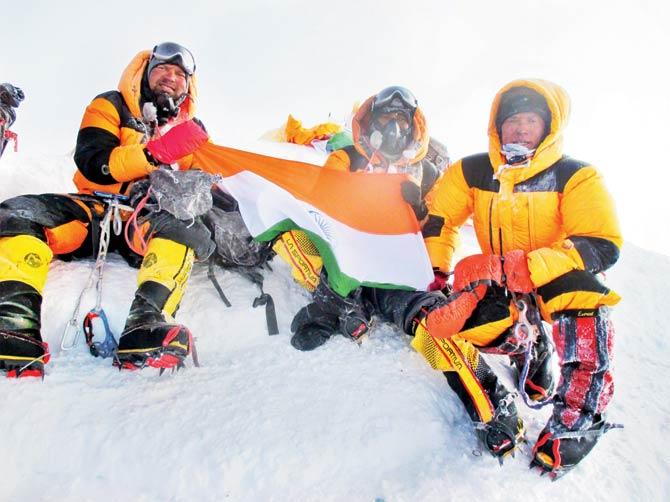 Another photo of Siddhanta and his mates atop the Everest at the same spot, which Siddhanta shared with mid-day to prove the authenticity of the photo above