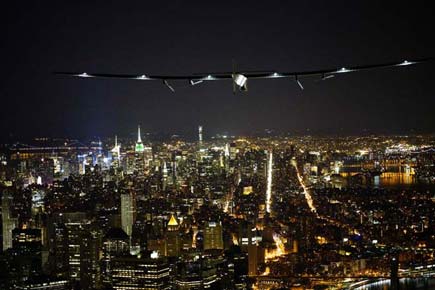 Photos: Solar Impulse 2 flies over New York City