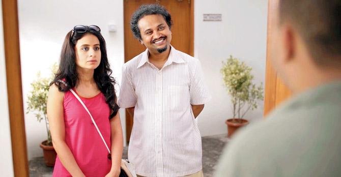 A scene from the video where tenant (Rasika Dugal) and broker (Soumik Sen) approach an owner 