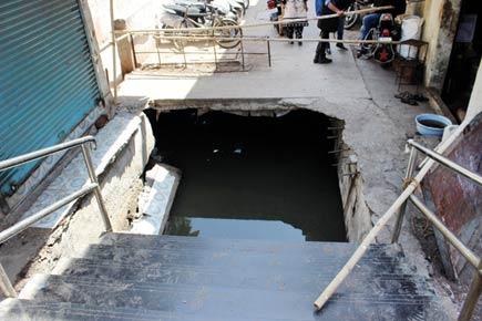 Commuters fall into gutter as slab outside Vasai station caves in